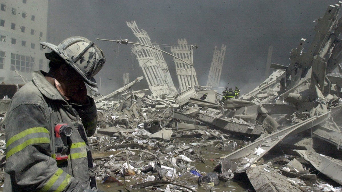 Firefighter looks down in aftermath of terrorist attacks on September 11, 2001 in New York City