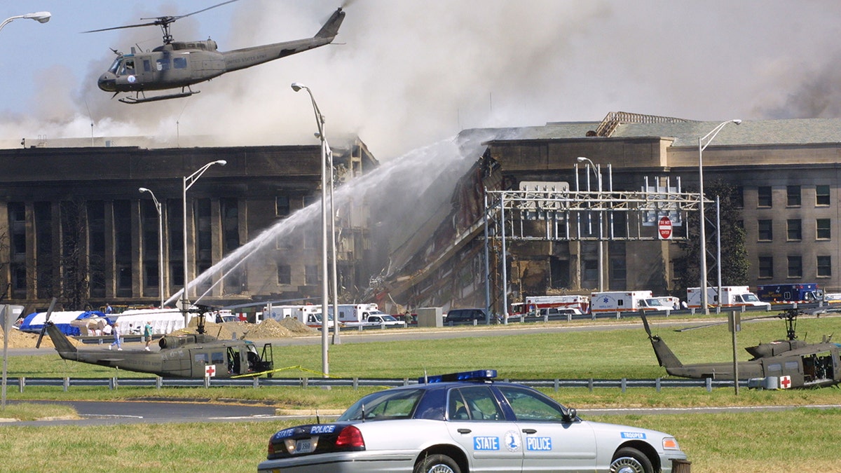 Smoke comes out from the Southwest E-ring of the Pentagon building Sept. 11, 2001 in Arlington, Virginia, after a plane crashed into the building and set off a huge explosion. 