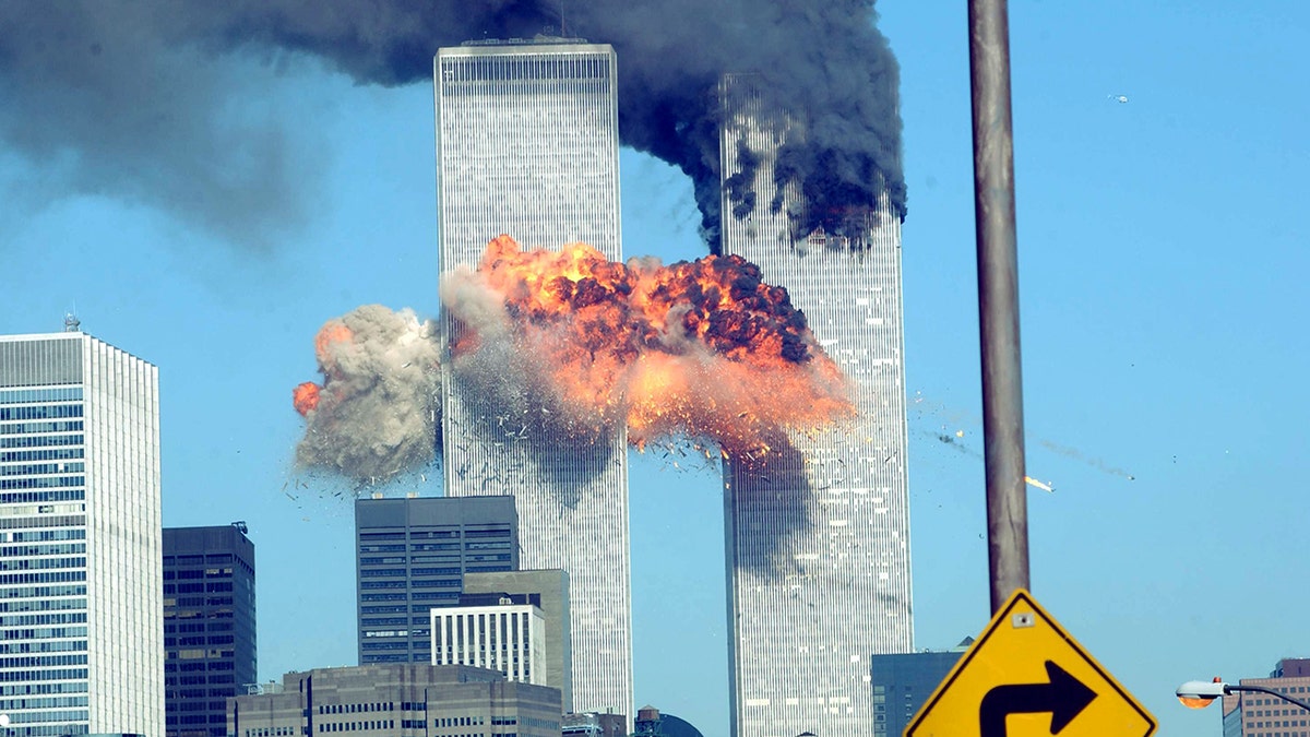 Building erupts in flames as a plane crashes into the World Trade Center on Sept. 11, 2001