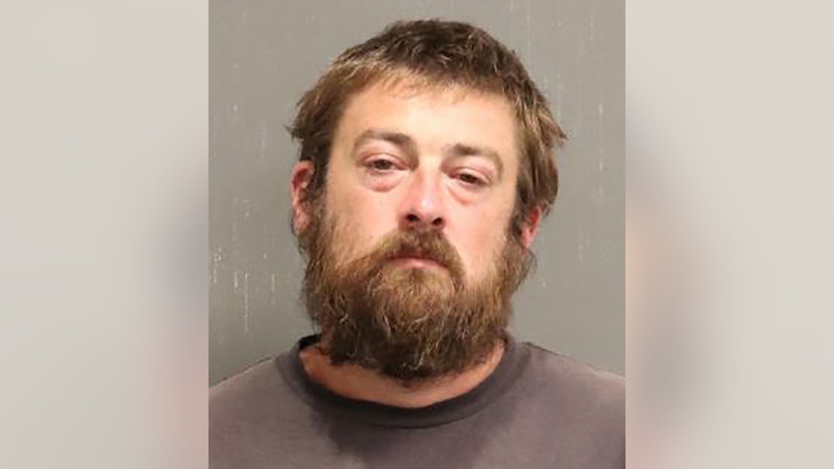 Thomas Henshall Jr. was charged with evidence tampering for touching and concealing the victim’s body, and failure to report the discovery of a dead body, police said.