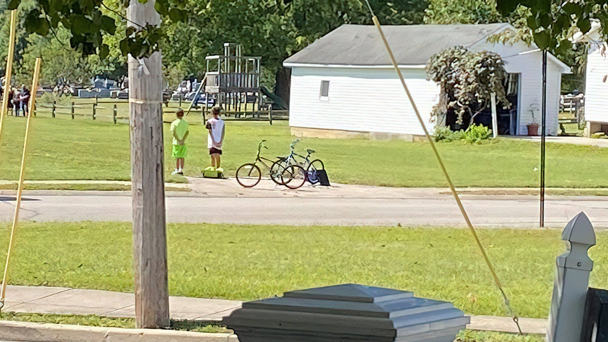 Two young boys honor military