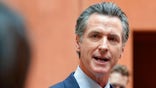FILE - In this Sept. 10, 2021, file photo California Gov. Gavin Newsom responds to a question while meeting with reporters after casting his recall ballot at a voting center in Sacramento, Calif. The last day to vote in the recall election is Tuesday Sept. 14. A majority of voters must mark "no" on the recall to keep Newsom in office. (AP Photo/Rich Pedroncelli, File)