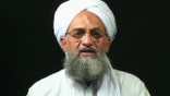 QATAR AND INTERNET OUT A frame grab from a videotape aired 05 August 2006 on the Qatar-based Al-Jazeera television network shows Al-Qaeda second-in-command Ayman Al-Zawahiri at an undisclosed place and time. Al-Zawahiri today announced that Egypt's Jamaa Islamiya militant group had formally joined the global terror network. AFP PHOTO/AL-JAZEERA