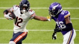 FILE - In this Dec. 20, 2020, file photo, Chicago Bears wide receiver Allen Robinson II (12) runs from Minnesota Vikings cornerback Chris Jones (26) after catching a pass during the second half of an NFL football game in Minneapolis. Robinson  insisted a contract negotiation that left him playing this season on the franchise tag rather than a multiyear deal did not give him a chip on his shoulder or an extra desire to show his worth. (AP Photo/Jim Mone, File)