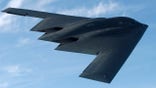 IN FLIGHT - MAY 8:  The bat-shaped B-2 stealth bomber with its flying wing design flies over Whiteman Air Force Base May 8, 2003 near Knob Noster, Missouri.  Whiteman is the home of the B-2's, of which there are only about twenty.  Each B-2 is worth about $2 million USD.  With the Wright Brothers' historic flight celebrating its centennial in 2003, the world is now poised on the threshold of a new age in aviation, one where super-sonic jets refuel in flight, unmanned aerial vehicles track objects with astonishing accuracy, and airliners are maneuvered at times with minimal human participation.  The computer age is about to revolutionize aviation and the United States is unquestionably ahead of the curve in this revolution.  (Photo by Joe McNally/Getty Images)