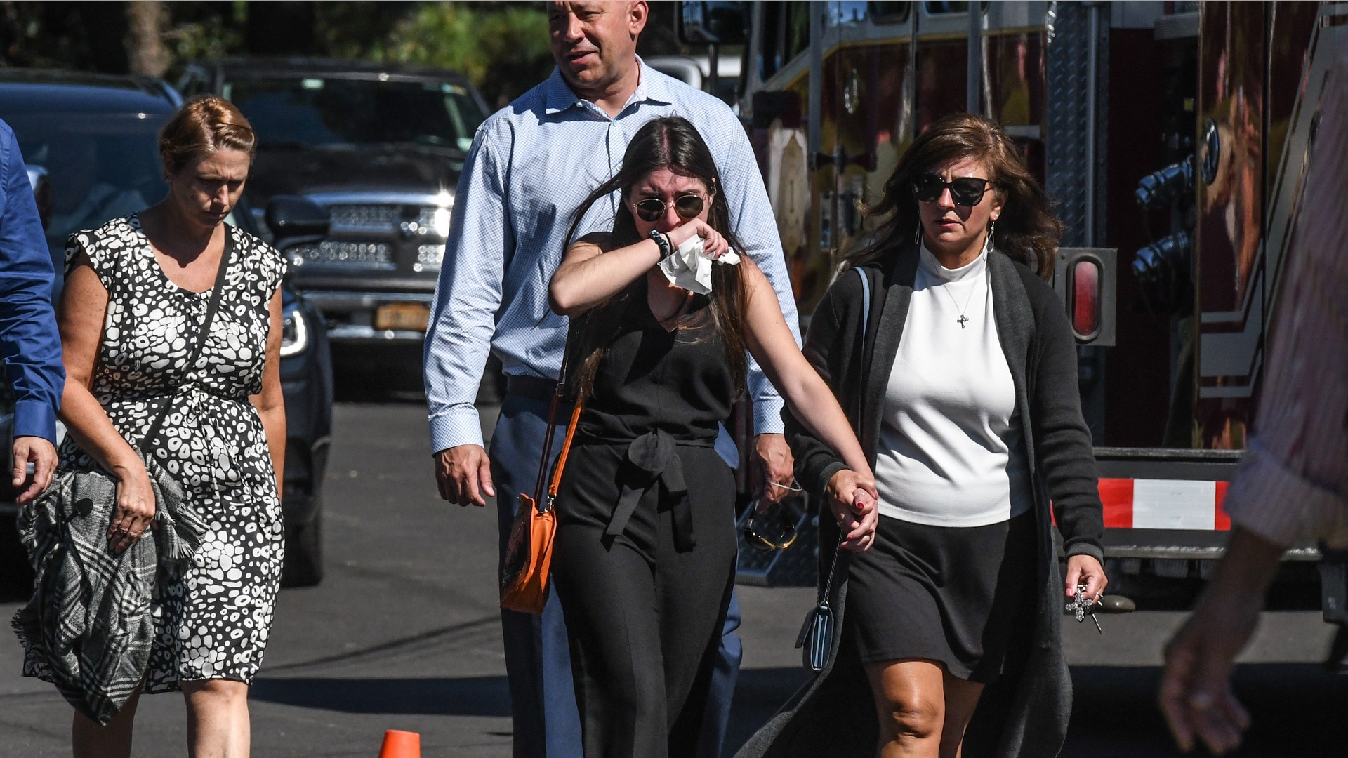 HOLBROOK, NY - SEPTEMBER 26: Mourners gather at a funeral home to pay respects to Gabby Petito on September 26, 2021 in Holbrook, New York. As the search continues for a second week in Florida to find Brian Laundrie, who is a person of interest, the family of Gabby Petito is holding a public funeral in her hometown of Long Island. 