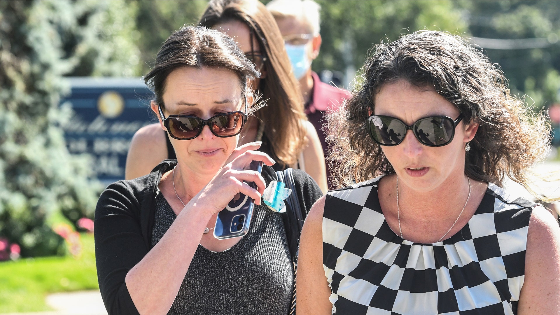 HOLBROOK, NY - SEPTEMBER 26: Mourners gather at a funeral home to pay respects to Gabby Petito on September 26, 2021 in Holbrook, New York. As the search continues into a second week in Florida to find Brian Laundrie, who is a person of interest, the family of Gabby Petito holds a public funeral in her hometown of Long Island. 