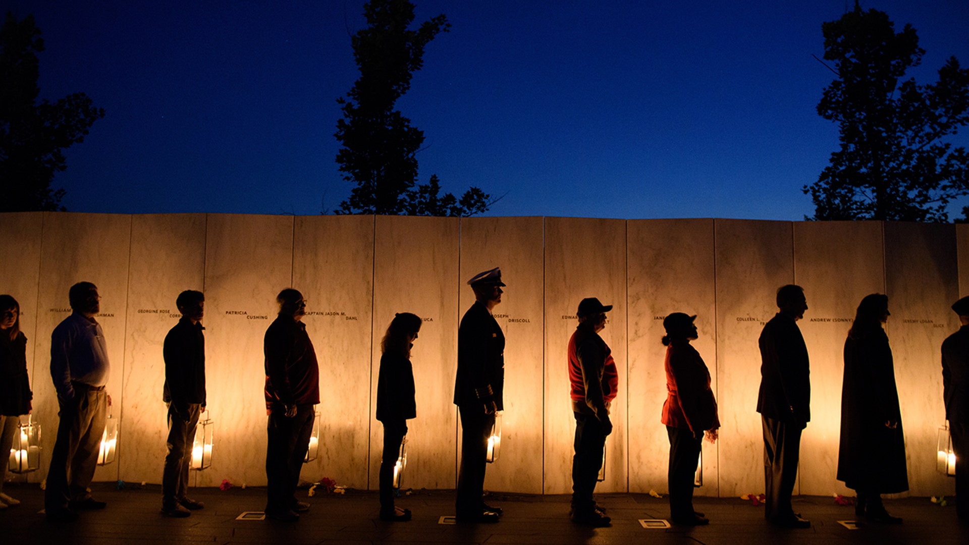 Visitors gather to pay respects during the Flight 93 National Memorial's annual Luminaria on the eve of 16th Anniversary ceremony of the September 11th terrorist attacks, Sept. 10, 2017, in Shanksville, Pa. United Airlines Flight 93 crashed into a field outside Shanksville with 40 passengers and 4 hijackers aboard on Sep. 11, 2001. (Photo by Jeff Swensen/Getty Images)