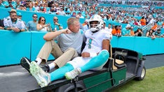 Dolphins' Tua Tagovailoa carted off the field with rib injury after taking big hit