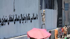 Taliban painting over western murals in Kabul, including one of George Floyd