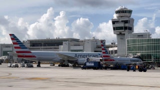 American Airlines passenger detained after opening emergency exit, walking on wing