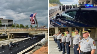 Firefighters stand in the rain to honor fallen US service member killed in Kabul