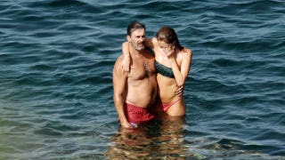 Hamming it up: 'Mad Men' star gets handsy with gal pal in Italy