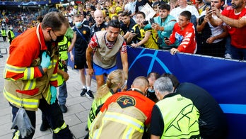 Cristiano Ronaldo drills woman with soccer ball during warmups prior to Champions League match