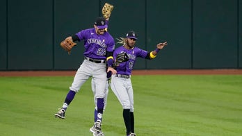 Rockies fall behind early, score 5 in 9th to beat Rangers