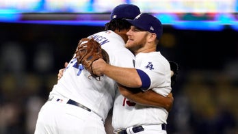 Dodgers clinch postseason berth in 8-4 win over D-backs