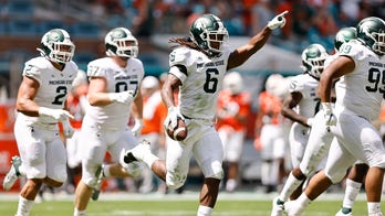 Spartans run: Michigan State rolls past No. 24 Miami, 38-17