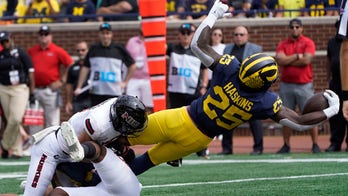Corum's 3 TDs help No. 25 Michigan rout N. Illinois 63-10