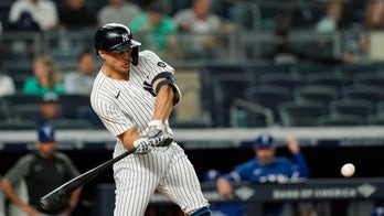 Yankees power past Rangers 7-1 to keep pace in playoff race