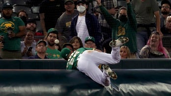 Mariners beat Athletics 5-2 to stay in AL wild-card chase