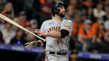 Giants top Rockies 7-2 for 100th win, hold onto NL West lead