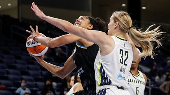 Cooper, Parker help Sky hold off Wings in playoff opener