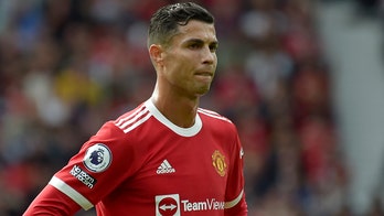Banner targets Cristiano Ronaldo at Old Trafford showing support for rape accuser