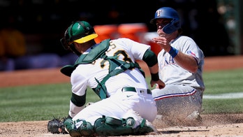 Rangers score five in 8th, come back to nip A's 8-6