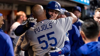 Dodgers beat Giants 6-1, move into tie for first in NL West