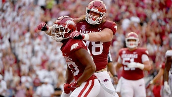 Arkansas manhandles No. 15 Texas, 40-21