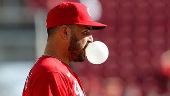 Reds rout Nationals 9-2 to keep slim playoff hopes alive