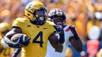 WVU builds big lead, holds on to beat No. 15 Va Tech 27-21