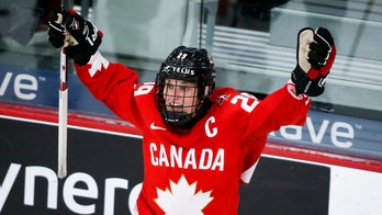 Poulin scores in OT, Canada wins 1st world title since 2012
