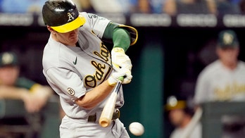 A's hold off Royals 12-10 to keep pace in AL wild-card race