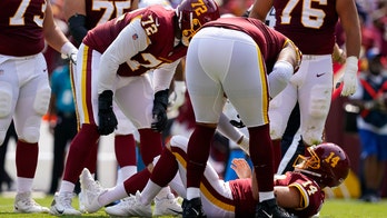 Washington's Ryan Fitzpatrick leaves game after taking huge hit from Chargers defender