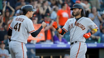 Giants hold NL West lead, top Rockies; Belt's hand injured