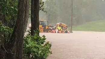 Maryland students rescued from submerged school bus as more than 80 roads closed due to flooding