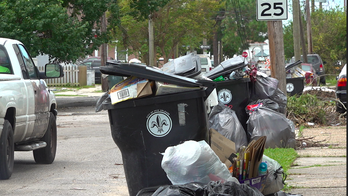 New Orleans residents hold 'trash parade' protest after garbage pickup delayed 3 weeks post Hurricane Ida