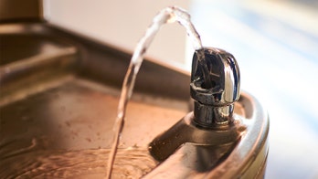 Photo of 'White' sign 'unintentionally' placed on water fountain, school says