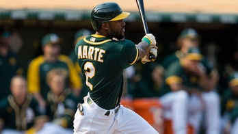 Marte's double in 9th lifts A's 2-1, stalls Astros