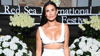 Demi Moore showcases abs in striped bikini: 'Leaping into fall!'