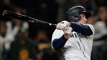 Contending Mariners win for 10th time in 11 games; A's out