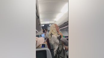 Couple in viral video kicked off JetBlue flight over refusal to wear masks, berating staff, airline says