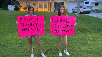 Gabby Petito disappearance: Protesters carry signs to home of Brian Laundrie urging him to speak with police