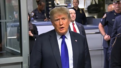 Trump pays tribute to 9/11 during visit to New York police precinct, hints at 2024 run