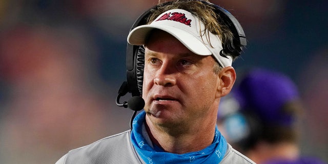 Mississippi head coach Lane Kiffin watches a replay during the second half of the team's NCAA college football game against Tulane on Saturday, Sept. 18, 2021, in Oxford, Miss. Mississippi won 61-21.