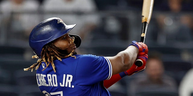 Vladimir Guerrero Jr. of the Toronto Blue Jays homers against the New York Yankees in the ninth inning of a game on September 9, 2021 in New York.
