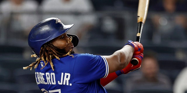 Vladimir Guerrero Jr. of the Toronto Blue Jays homers against the New York Yankees in the ninth inning of a game on September 9, 2021 in New York.