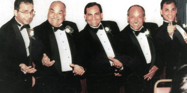 Adam Arias (right) pictured with his brothers and father (Don Arias)
