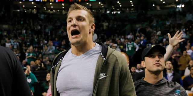Rob Gronkowski reacts after a basket by the Boston Celtics during the game against the LA Clippers in the second quarter at TD Garden.